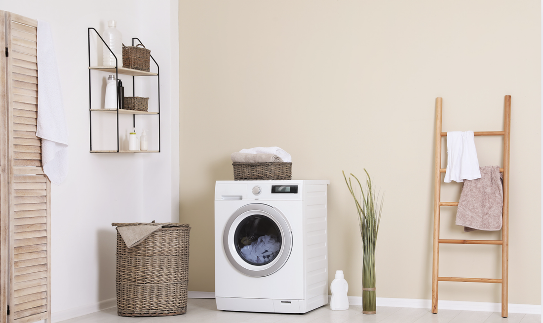 Washing machine and laundry baskets in a bright laundry room
